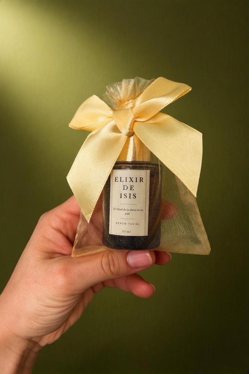 Elixir de Isis de Orogen, en frasco de 30 ml con bolsa dorada y lazo